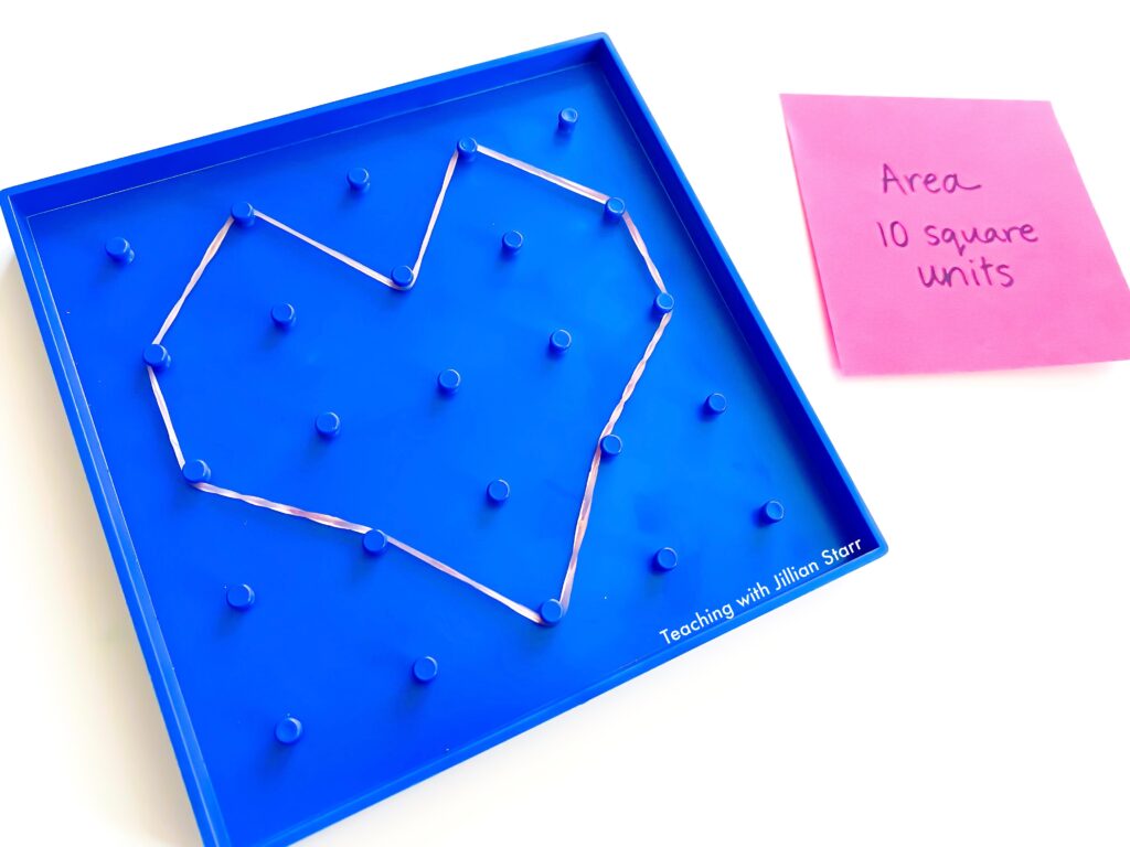 Geoboards are a great tool to teach area and perimeter. This geoboard is showing a shape with vertical and diagonal lines. There is a post-it note next to it noting its area.